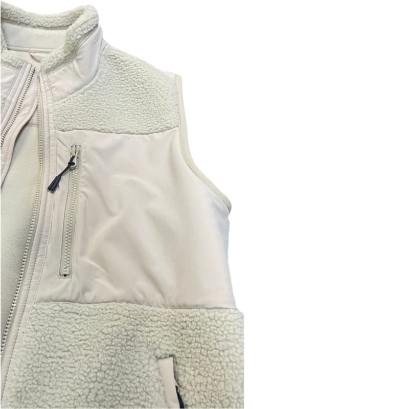 Close-up of women beige sherpa vest chest zipper pocket and mixed fabric splicing