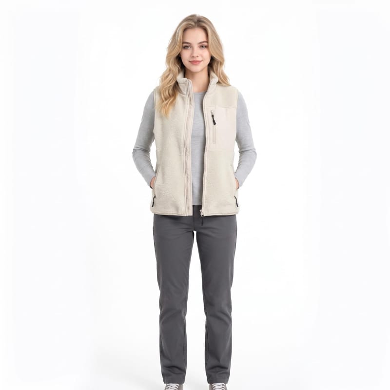 Full body studio photo female model in beige sherpa fleece vest, white background