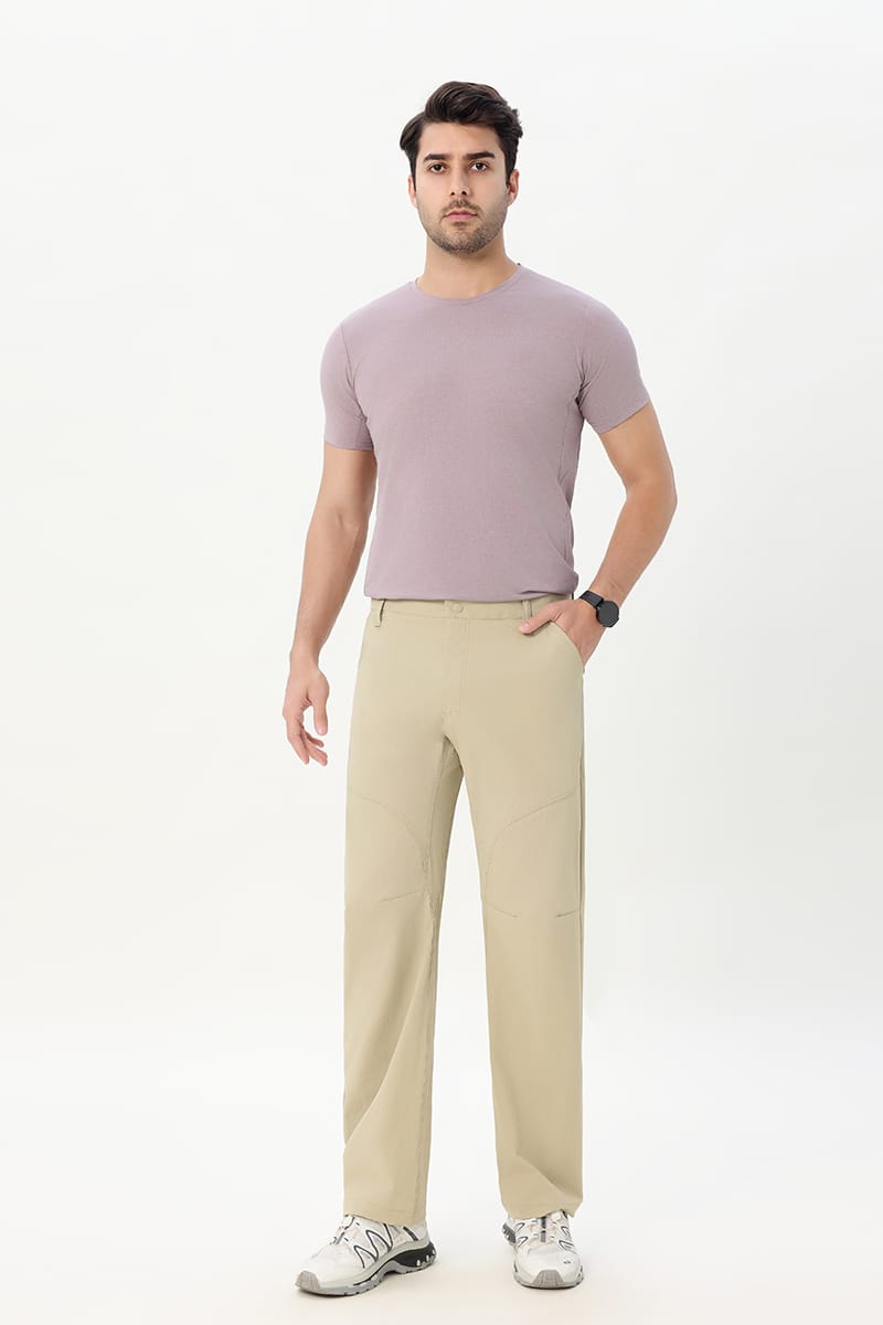 Male model wearing Tensuit khaki stretch outdoor hiking pants front view