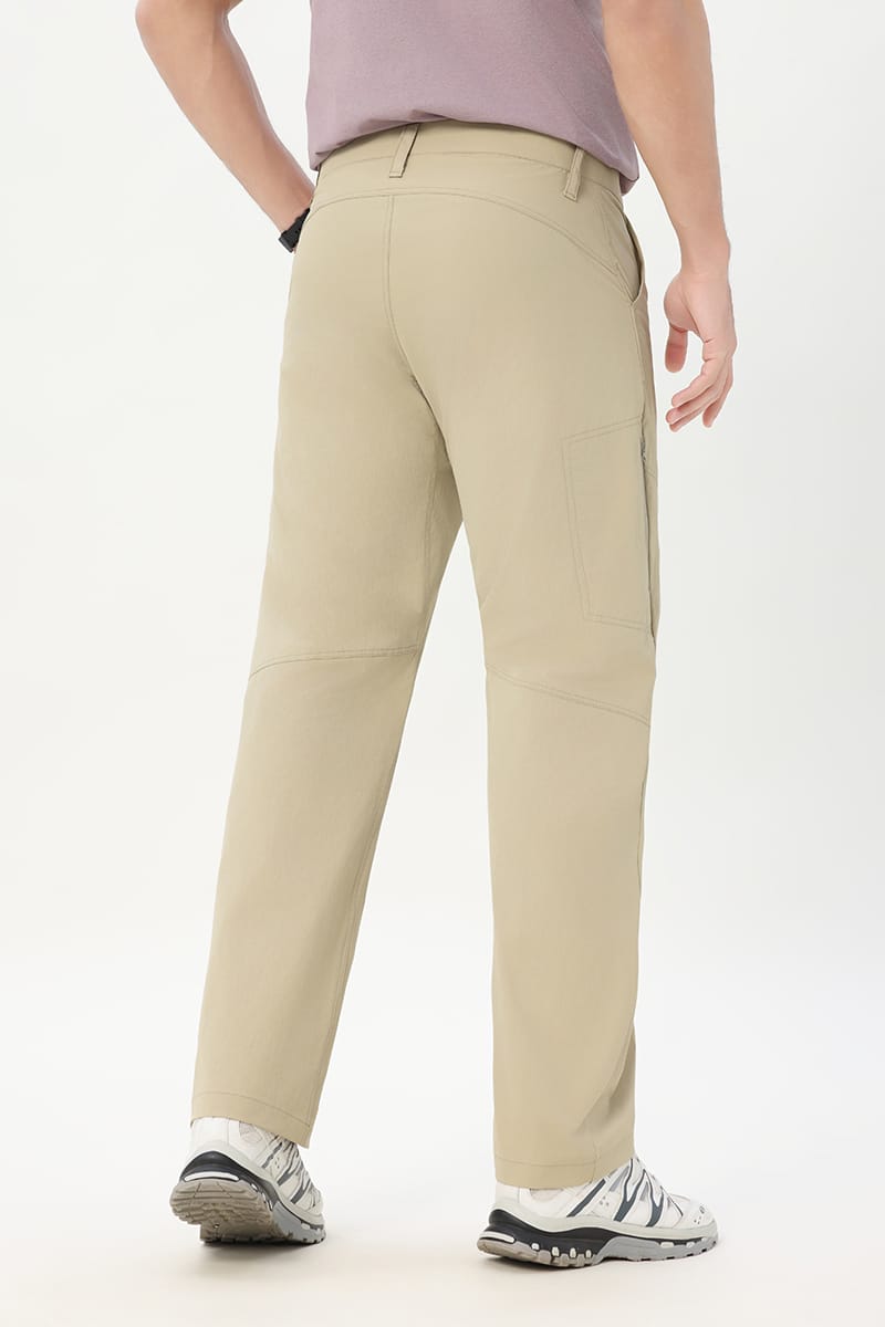 Male model wearing Tensuit khaki stretch outdoor hiking pants back view