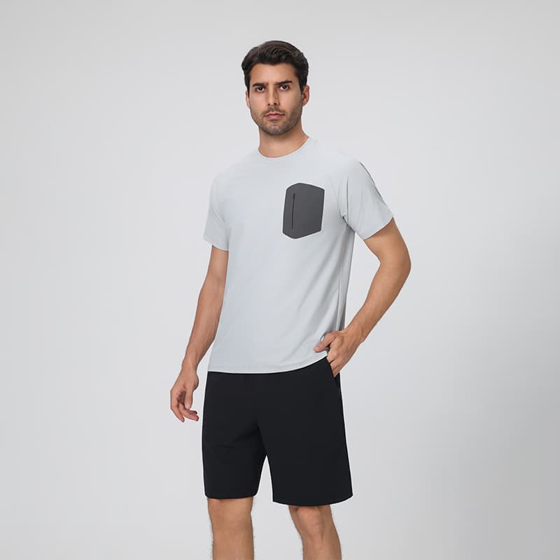 Man wearing Tensuit P177 quick dry workout t shirt front view, silver gray with zipper chest pocket